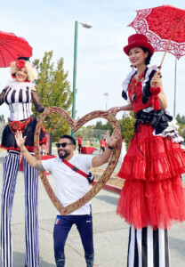 Circus Stilt Walkers at Heart Walk with big love heart frame by Catalyst Arts